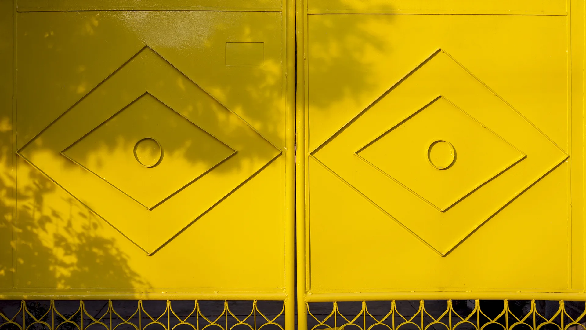 Freshly painted yellow metal gate