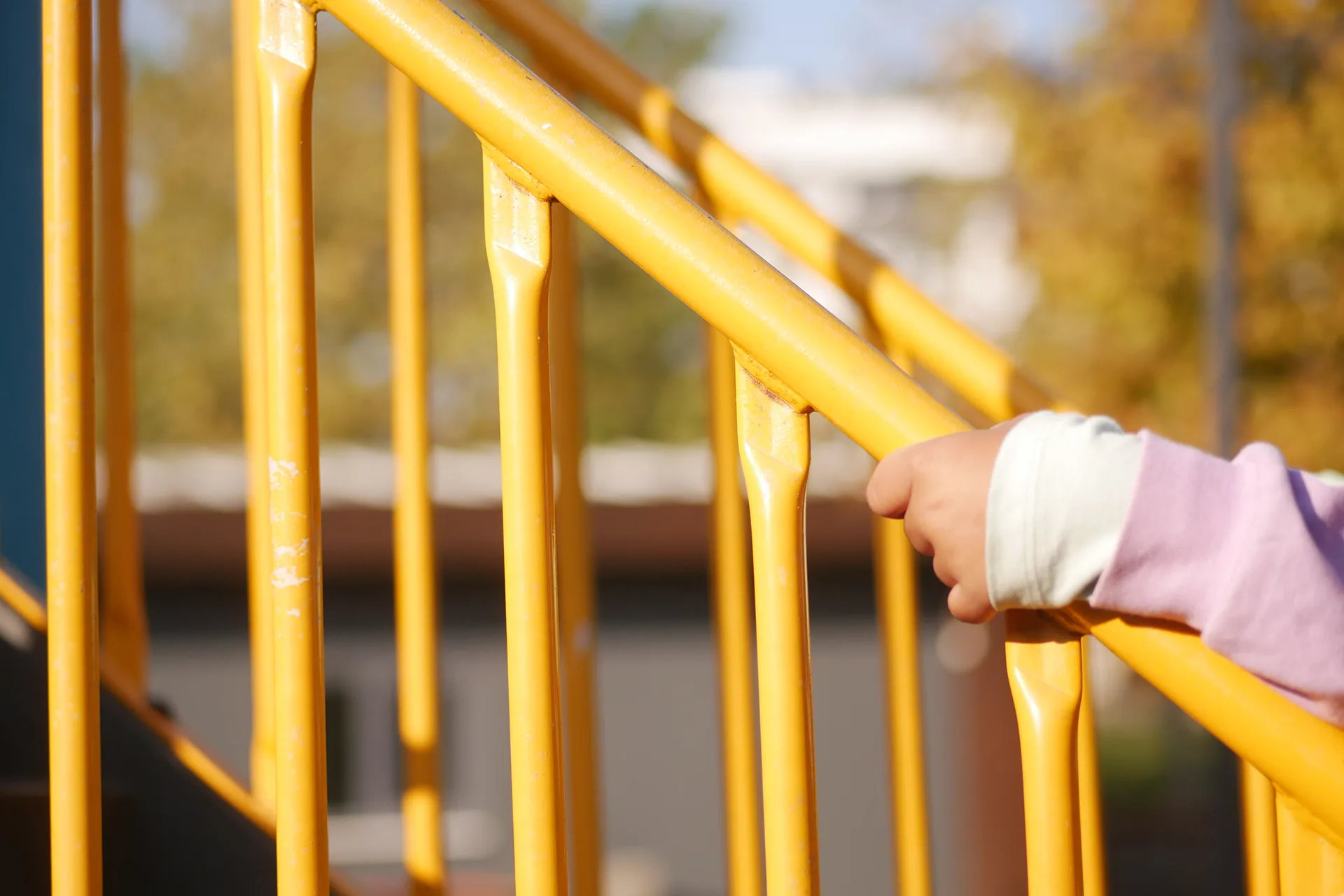 Painted yellow metal handrail