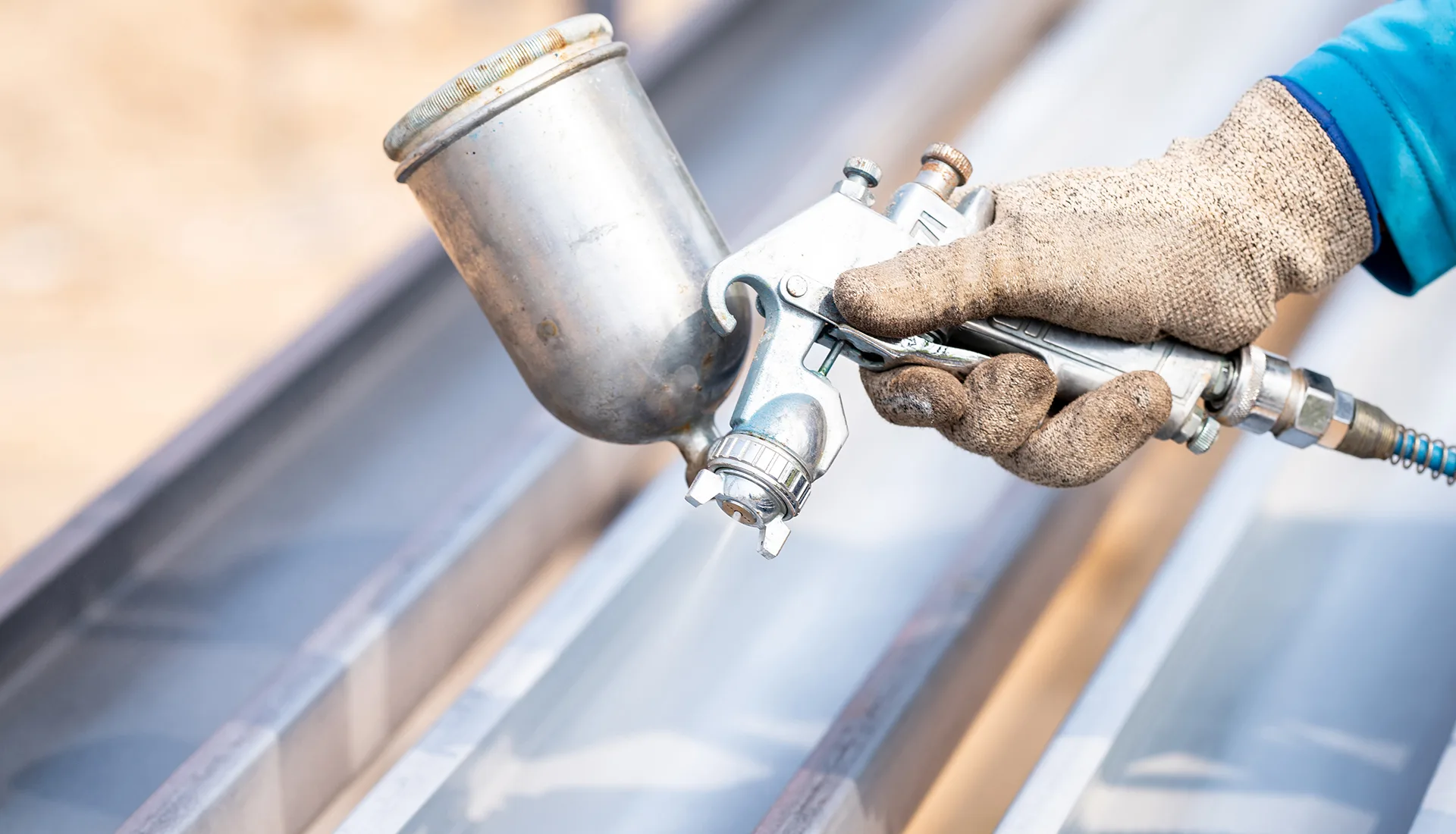 Spray coating applied to a metal frame
