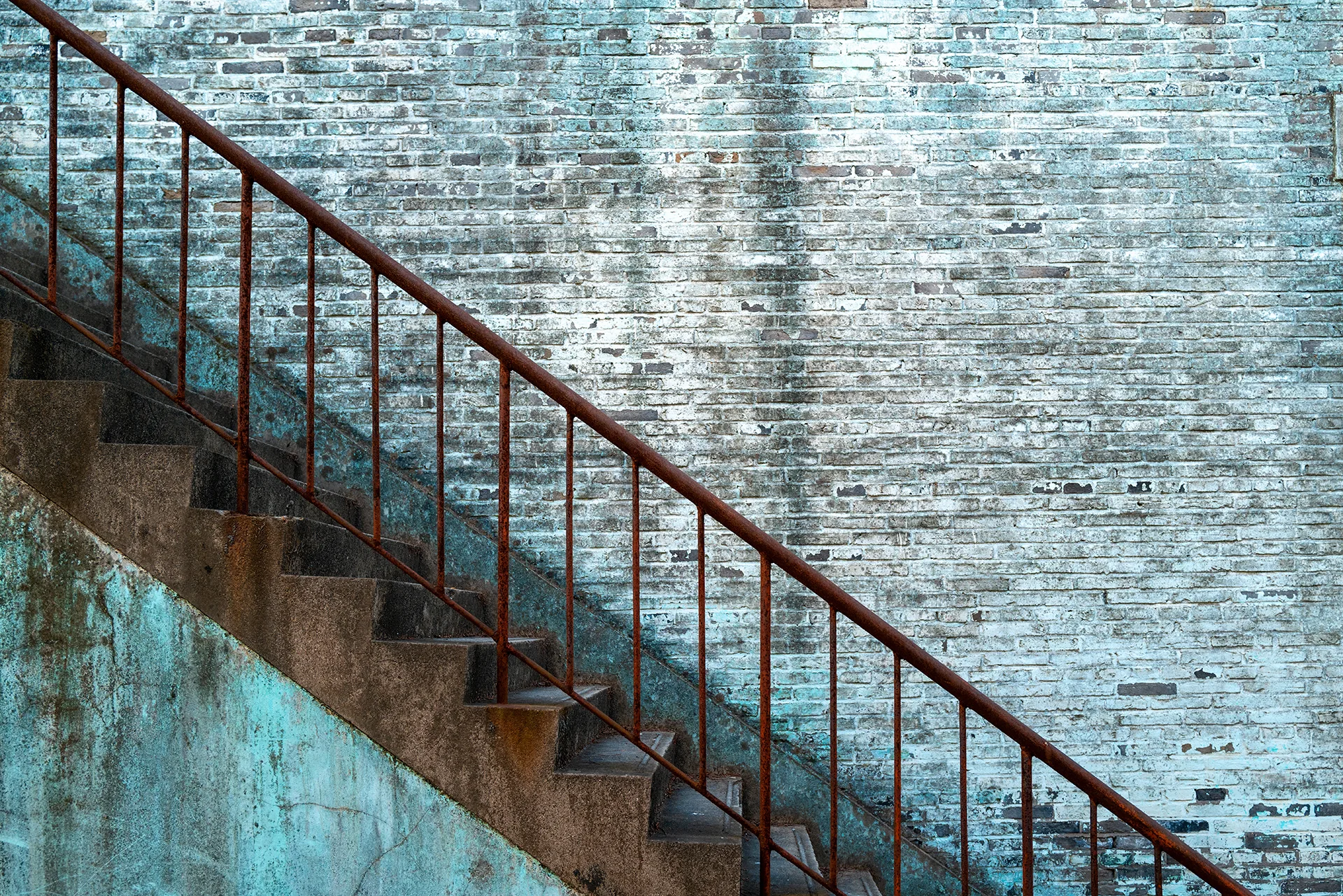 Rust on an outdoor metal staircase railing
