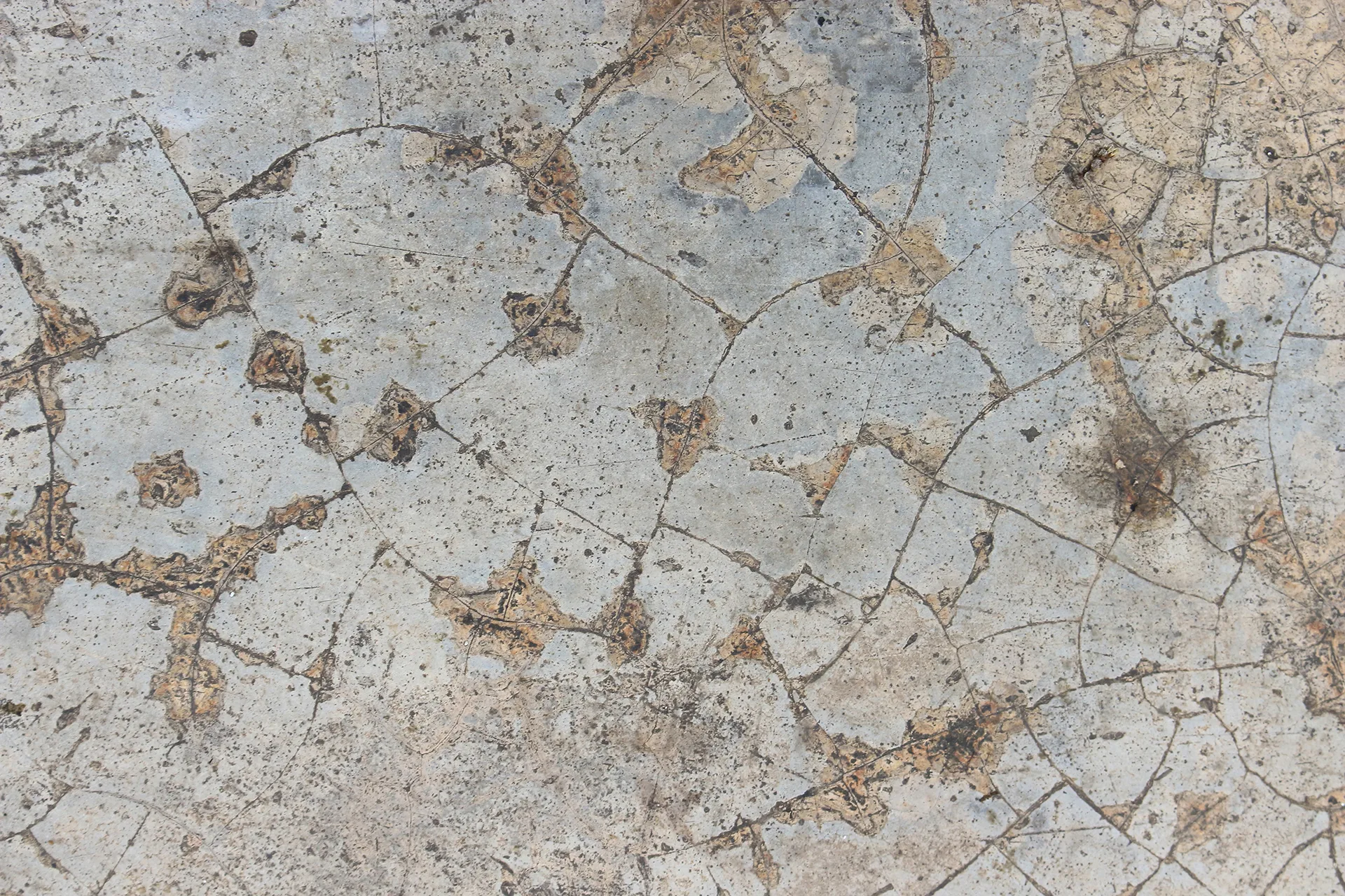Close-up of widespread cracking and deterioration in concrete