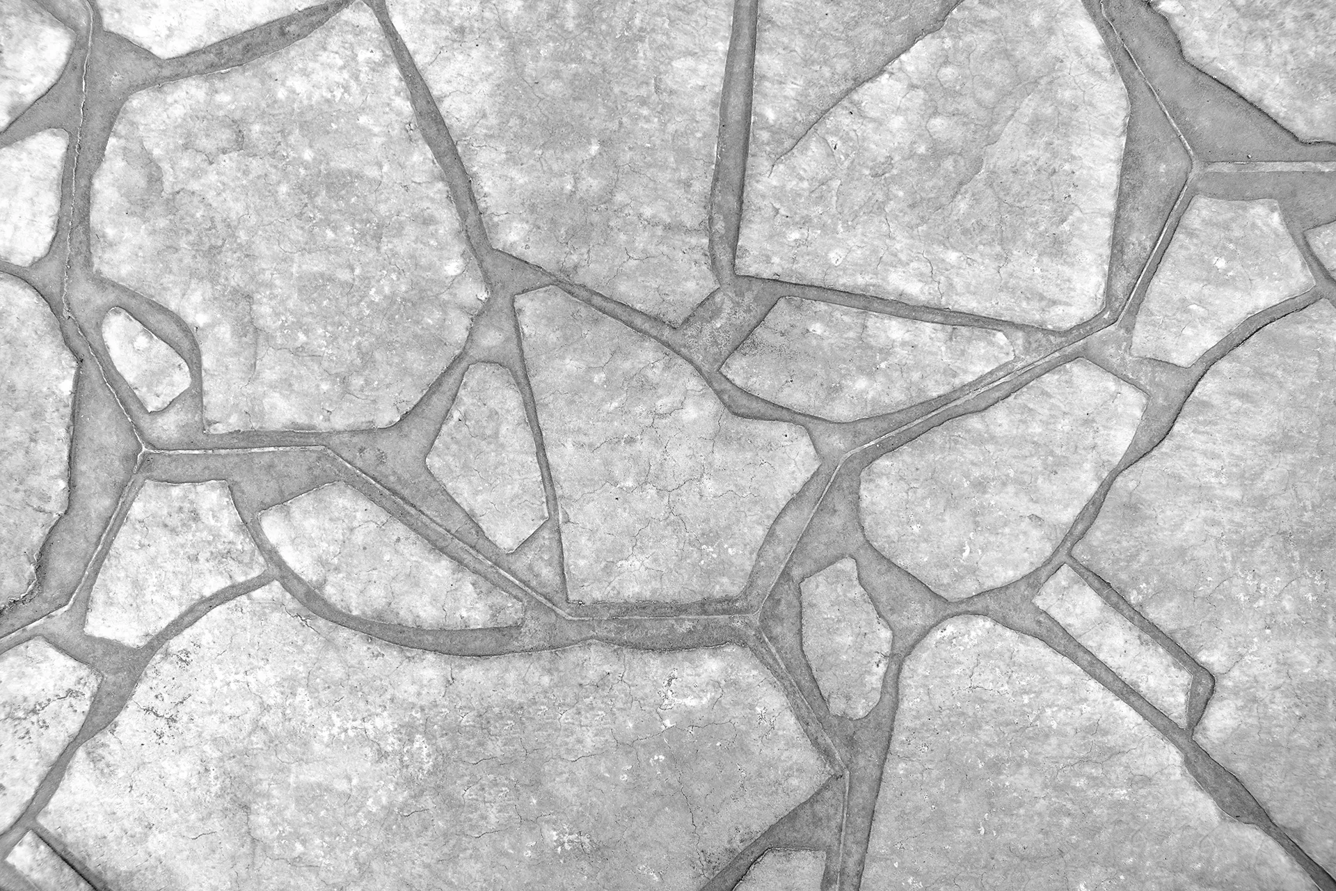 Repaired cracks across a concrete surface