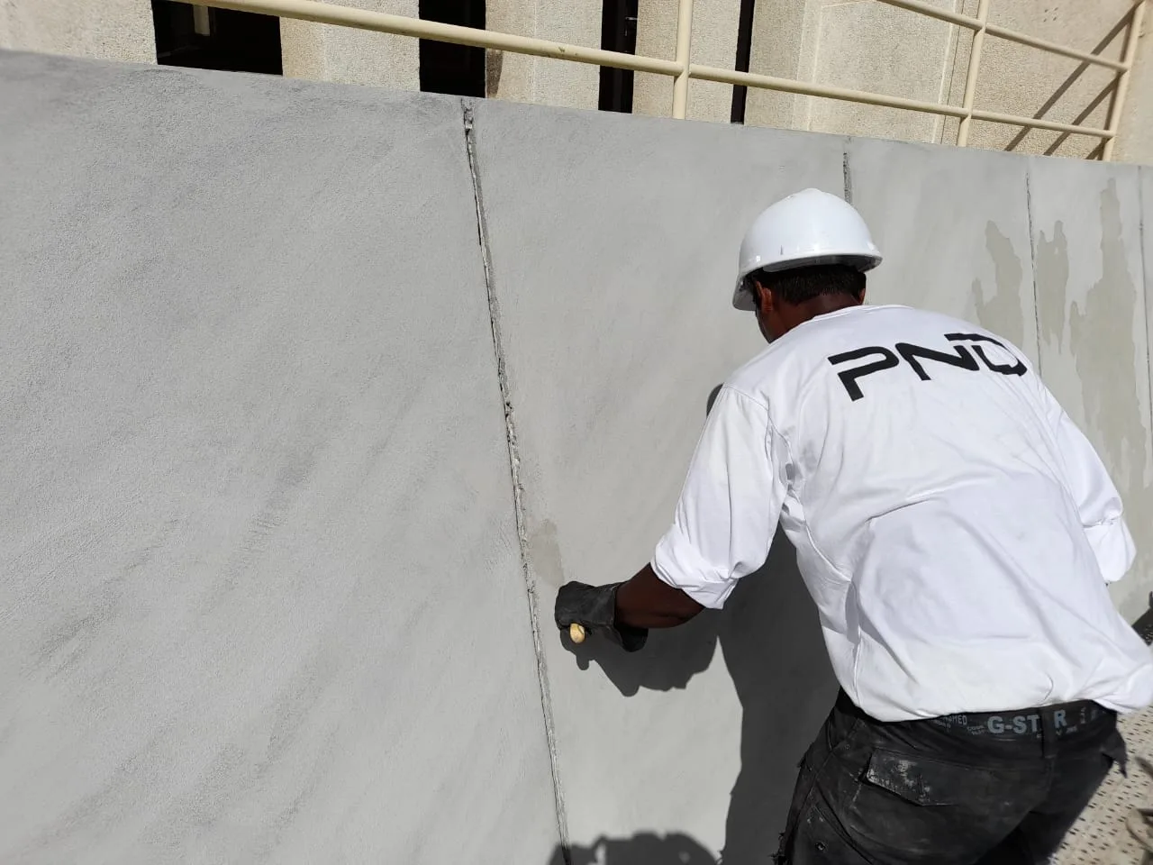 PND concrete repair specialist restoring a damaged wall