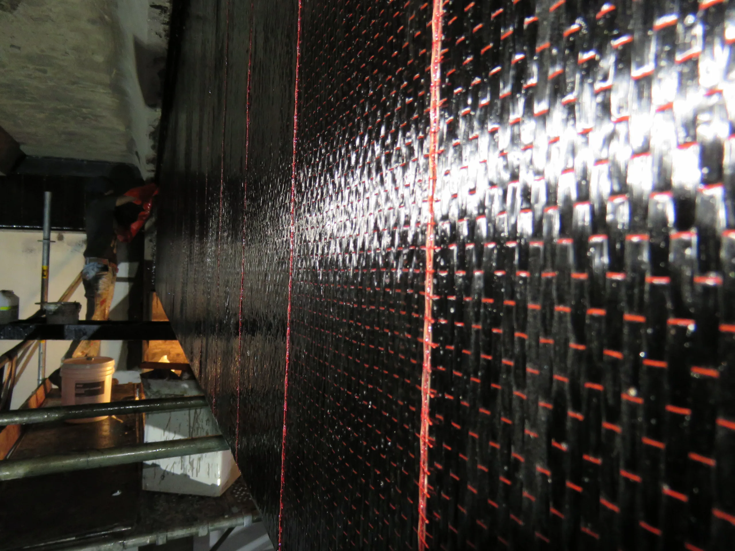 Carbon fibre reinforcement applied to a concrete structure
