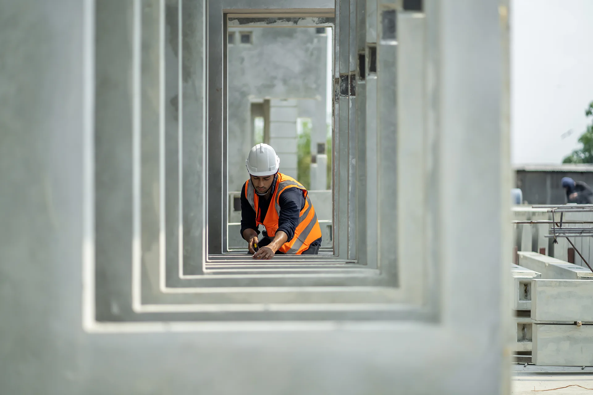 Construction professional assessing concrete work on site